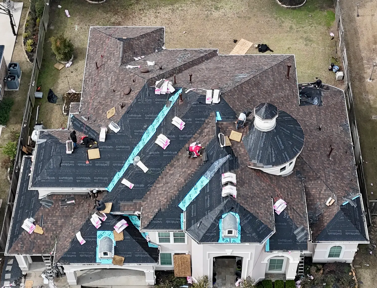 ace construction roofing crew ontop of roof working